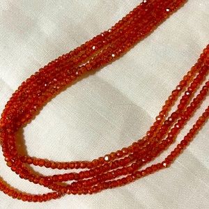 Beautiful reddish orange stones made into a necklace with clasp